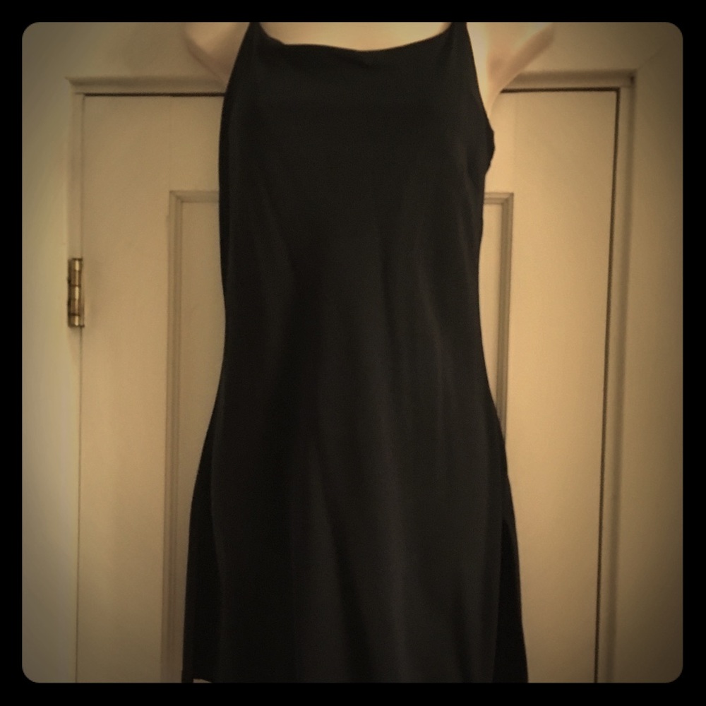 Black long top with slits on side. Build in bra